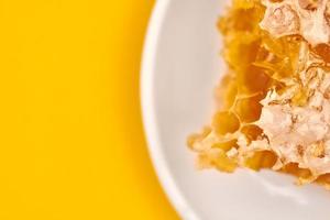 Honeycomb on plate, copy space, macro close up photo