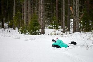 Sport photographer lies on snow. photo