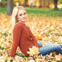 Young woman in park on autumn day photo