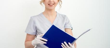 Young woman holding blue folder photo