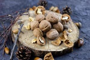 a group of walnuts on a dark background, a concept for the winter season. photo