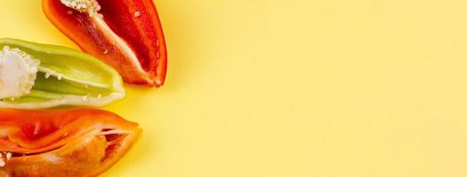 three cut multi-colored ripe peppers photo