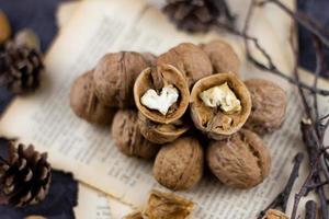 a group of walnuts on a dark background, a concept for the winter season. photo