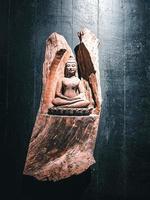 Wooden statue of Lord Buddha. photo