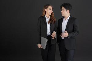 Business men and business women stand to talk business with smiling. photo