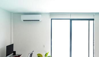 Air conditioner on white wall photo