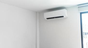 Air conditioner on white wall photo