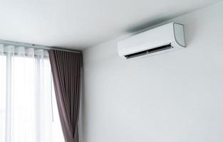 Air conditioner on white wall photo