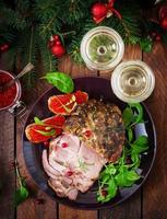 Christmas baked ham and red caviar, served on the old wooden table. Flat lay. Top view photo