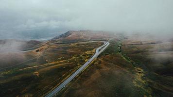 car moves in fog top view photo