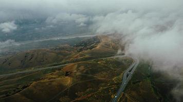 car moves in fog top view photo