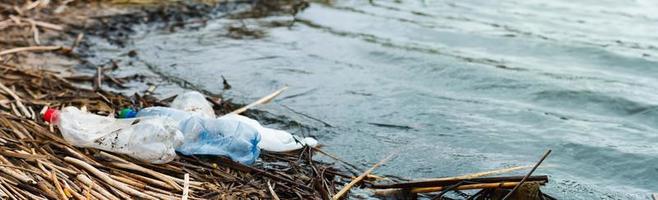 ocean rubbish banner. Polluted coastline, with place for an inscription. photo