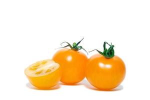 yellow tomatoes on white background photo