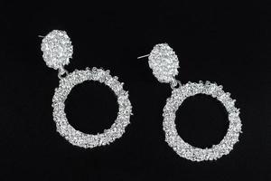 Jewelry earrings and costume jewelry on a black background photo