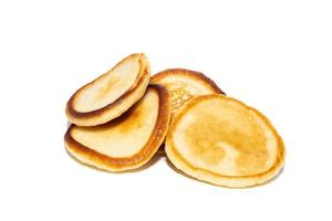 Stack of tasty pancakes on white background photo