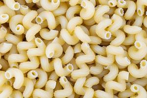 Background of dry pasta cavatappi. Selective focus. photo