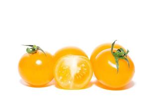 yellow tomatoes on white background photo