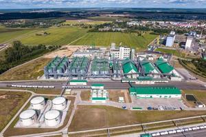 aerial view on rows of agro silos granary elevator with seeds cleaning line on agro-processing manufacturing plant for processing drying cleaning and storage of agricultural products photo