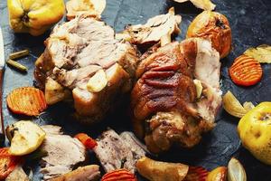 Pork leg grilled with apples photo