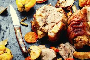 Roasted meat with autumn fruits photo