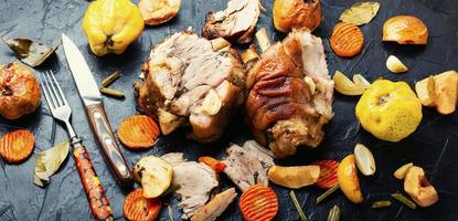 Roasted meat with autumn fruits photo