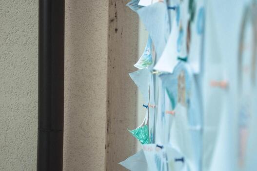 Sheets of paper, notes, drawings, documents pinned to a blackboard, a wall for a reminder, submission of announcements, scheduling and copy space. Background, texture photo