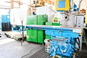 Industrial iron lathe for cutting, turning of billets from metals, wood and other materials, turning, manufacturing of details and spare parts at the factory photo