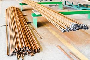 Warehouse, a repository of metal iron long thin rusty pipes at a petrochemical, metallurgical industrial plant photo