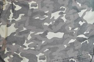 Camouflage background texture as backdrop for paintball and airsoft strikeball design projects photo