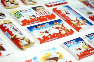 KHARKOV, UKRAINE - DECEMBER 8, 2020 Many different products by Kinder brand made by Ferrero SpA. Kinder is a confectionery product brand line of Italian manufacturer Ferrero photo