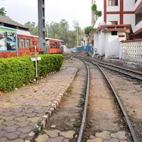 View of Toy train Railway Tracks from the middle during daytime near Kalka railway station in India, Toy train track view, Indian Railway junction, Heavy industry photo