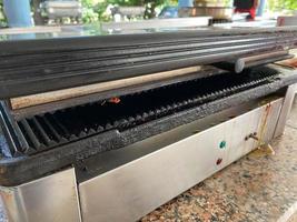 Grill for frying meat, fish, vegetables, electric grill for cooking healthy food without oil photo
