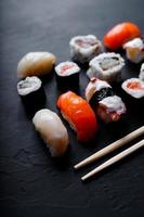 japanese sushi food. Maki ands rolls with tuna, salmon, shrimp, crab and avocado. Top view of assorted sushi. photo