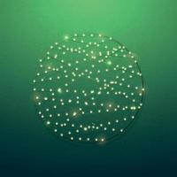 Decorative Christmas circle made of lights on green background. vector