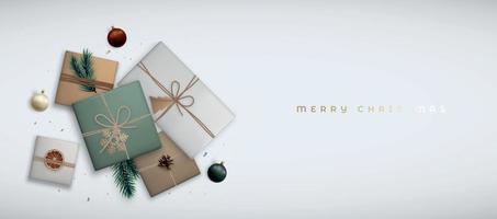 banner de navidad con vista superior. composición plana con cajas de regalo artesanales realistas sobre fondo gris. vector