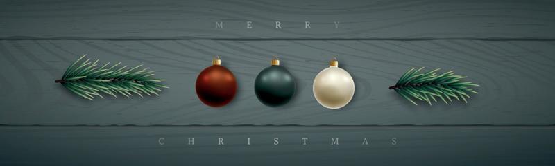 Christmas horizontal banner with realistic shiny baubles and spruce branches.