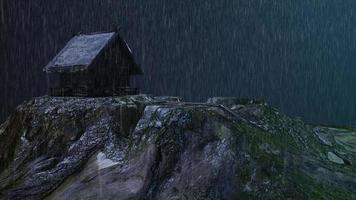 Rain rains wet poor hilly cottages in remote countryside at night video