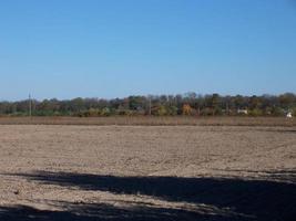 Panorama of a plowed autumn field photo