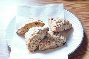 blue berry scones served in white plates photo