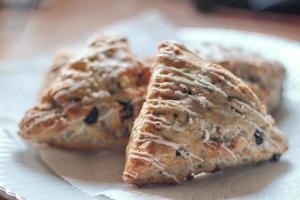 blue berry scones served in white plates photo