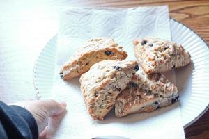 blue berry scones served in white plates photo