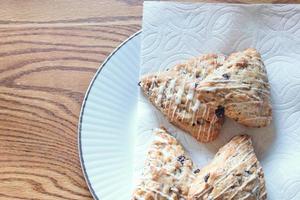 blue berry scones served in white plates photo