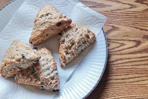 blue berry scones served in white plates photo