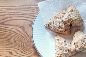 blue berry scones served in white plates photo