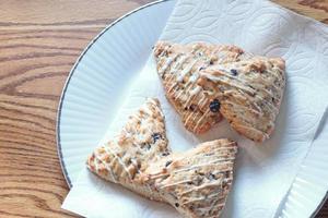 blue berry scones served in white plates photo