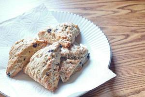 blue berry scones served in white plates photo