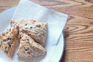 blue berry scones served in white plates photo