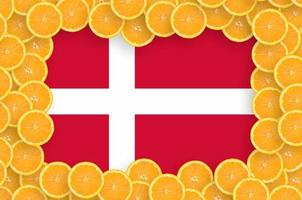 Denmark flag  in fresh citrus fruit slices frame photo