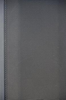 Abstract black metallic mesh texture pattern for Industrial background. Speaker of musical column and free space for text photo