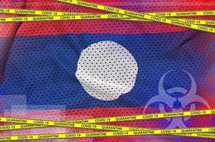 Laos flag and Covid-19 quarantine yellow tape. Coronavirus or 2019-nCov virus concept photo